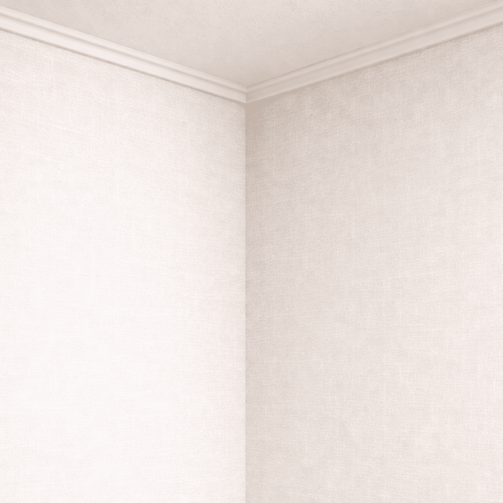 2面の壁紙が交わる室内の入隅部分で、天井との取り合いも含めて仕上がりが確認できるコーナーの様子